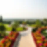 A panoramic view of Umm Emarat Park showcasing its lush greenery and vibrant flower beds.